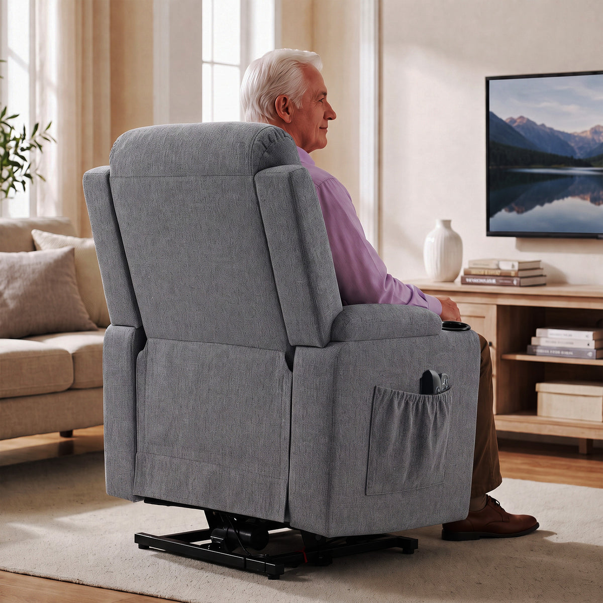 Gray power lift recliner chair with padded armrests and extended footrest base