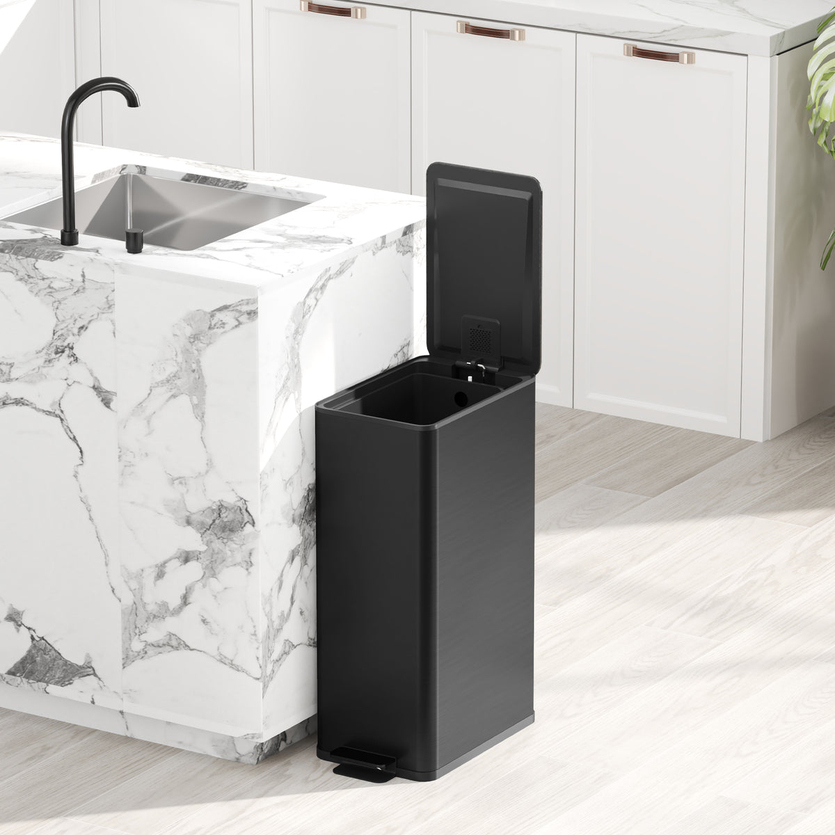 Black kitchen pedal trash can with open lid and visible inner bin.