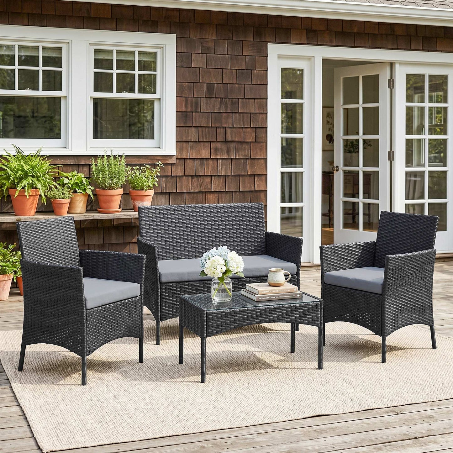 Outsunny 4 Piece Rattan Garden Furniture Set With Loveseat, Armchairs, Glass Top Coffee Table And Cushions Black