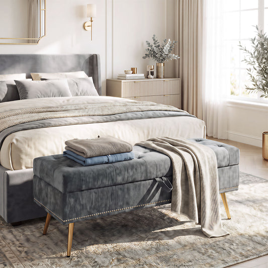 Grey chenille storage ottoman with tufted padded seat and hidden compartment, on metal legs