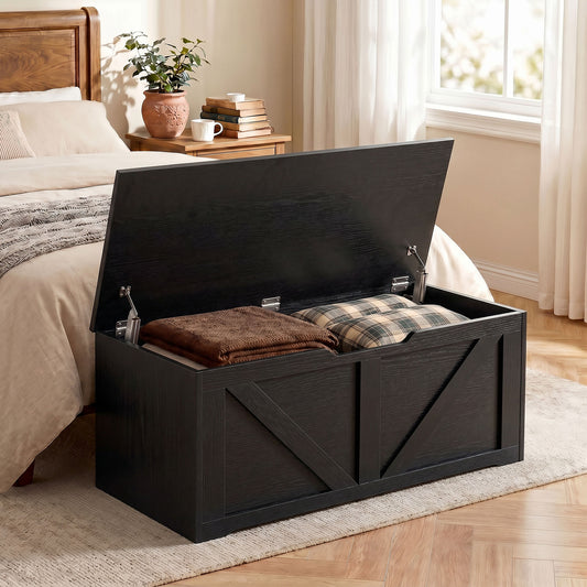 Black wood-effect storage box with hinged lid and safety hinges, seat-on design