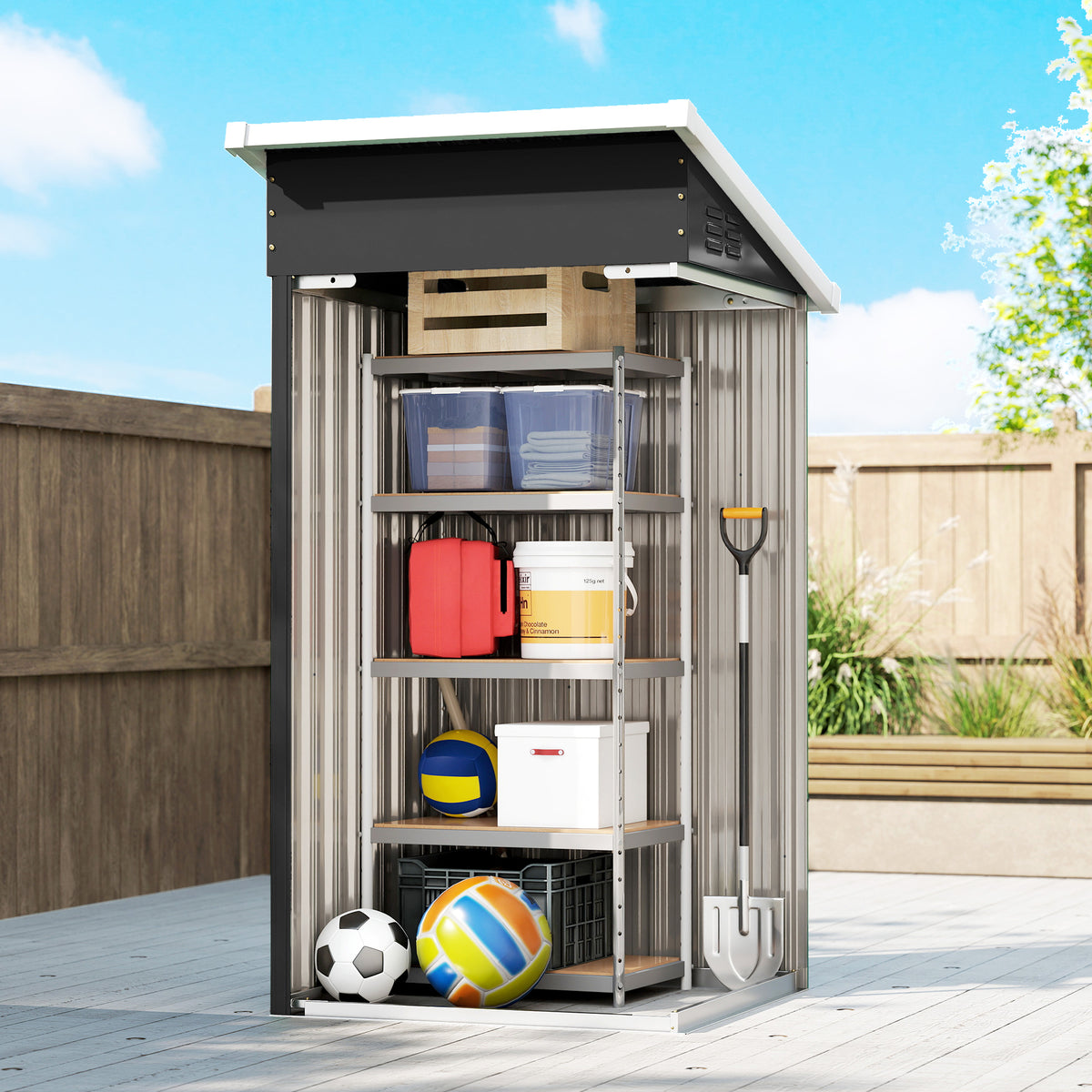 Outdoor metal storage shed, sloped roof above open door with tools and sports balls inside