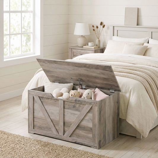 Grey wood-effect storage bench with hinged lid open, revealing bedding and toys.