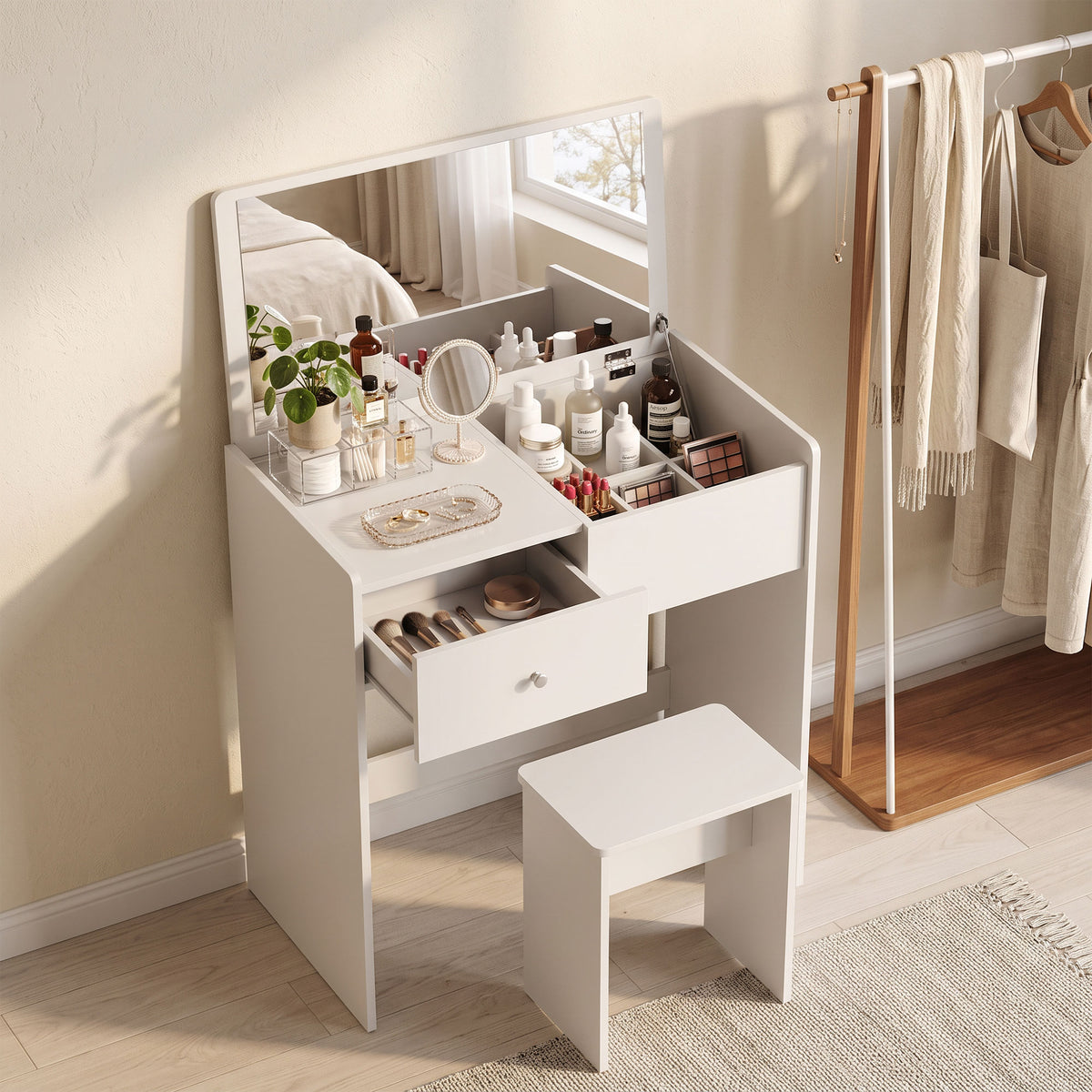 White vanity desk with mirror, open drawers, and matching stool for toiletries