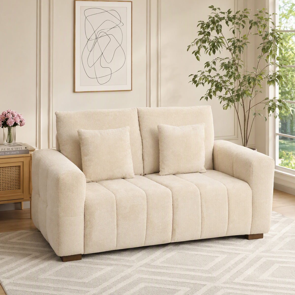 Cream white velvet loveseat sofa with three seat segments and two back pillows