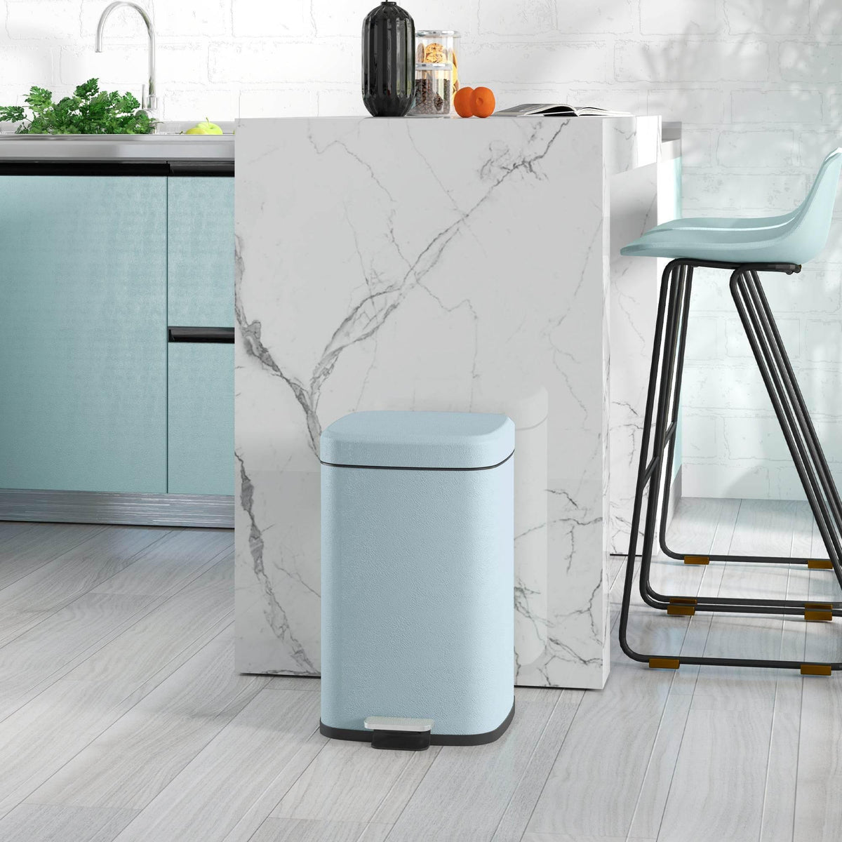 Light green metal kitchen pedal bin with foot pedal and hinged open lid