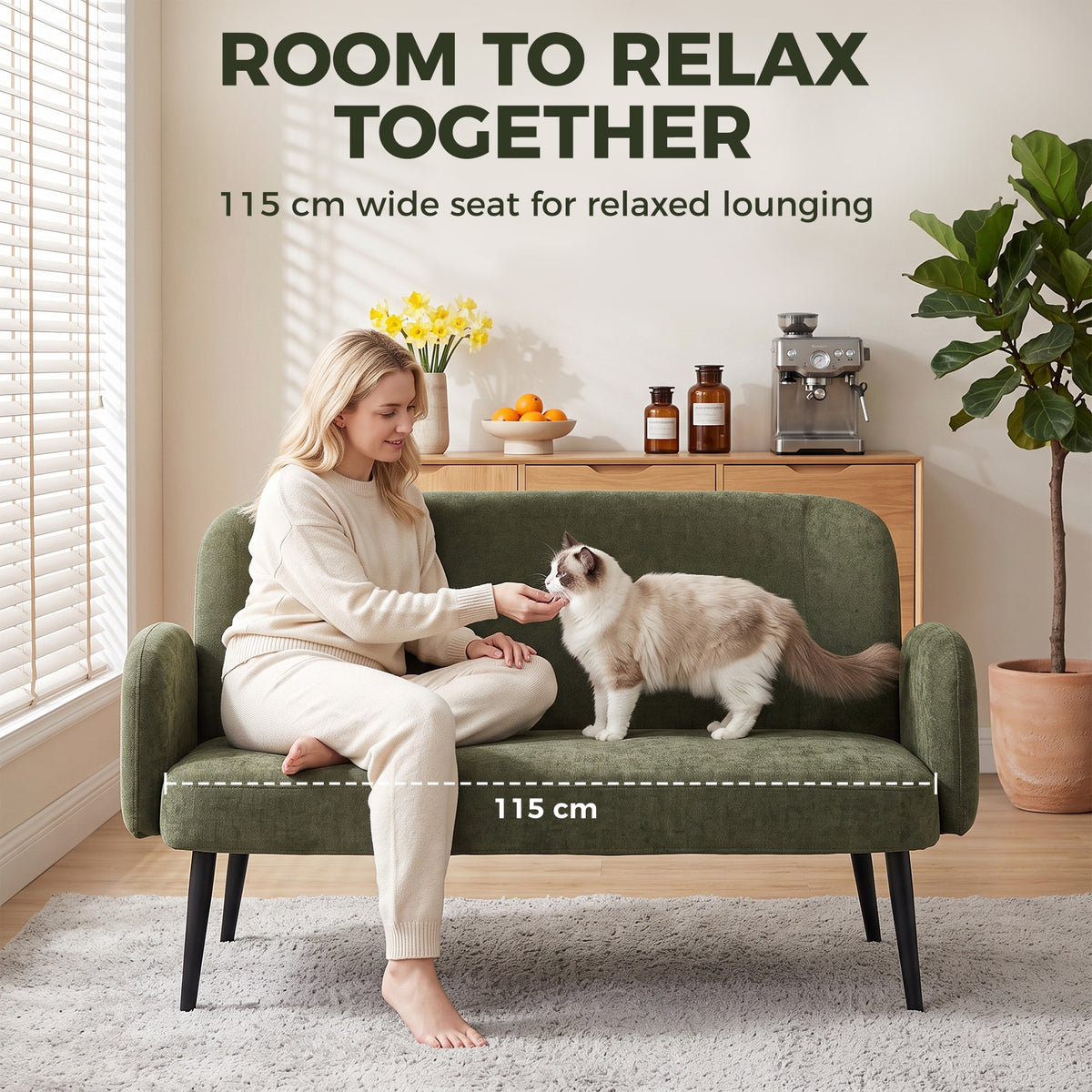 Green velvet 2-seat sofa with wide seat and curved arms, pet lounging view