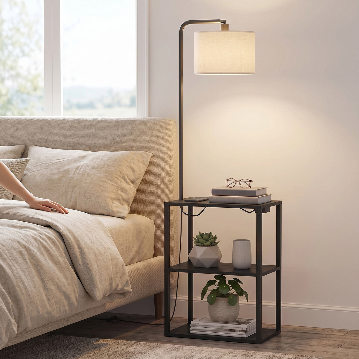 Black floor lamp with off-white shade and 3-tier shelving beside sofa
