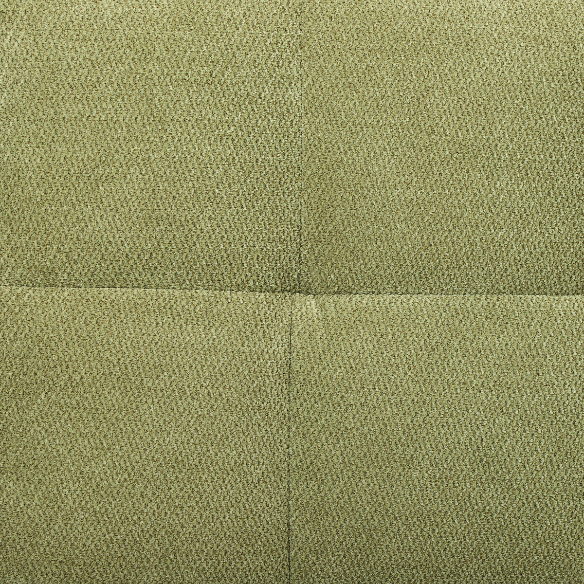 Green velvet upholstery fabric close-up with textured woven surface.