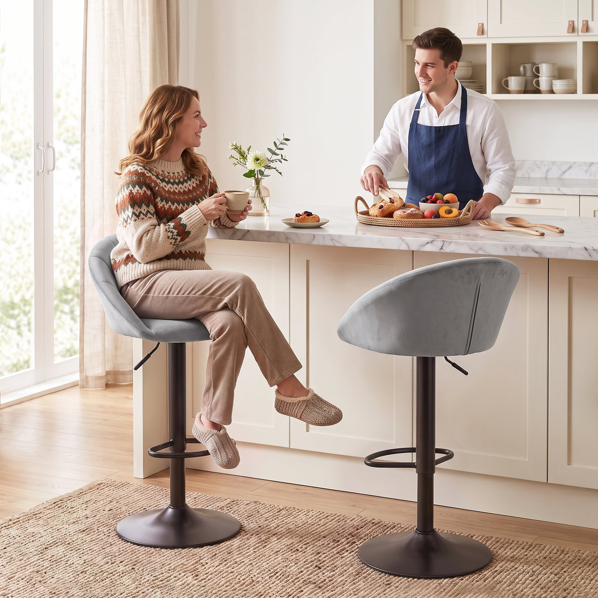 Set of 2 adjustable bar stools with light gray velvet seats and black swivel bases