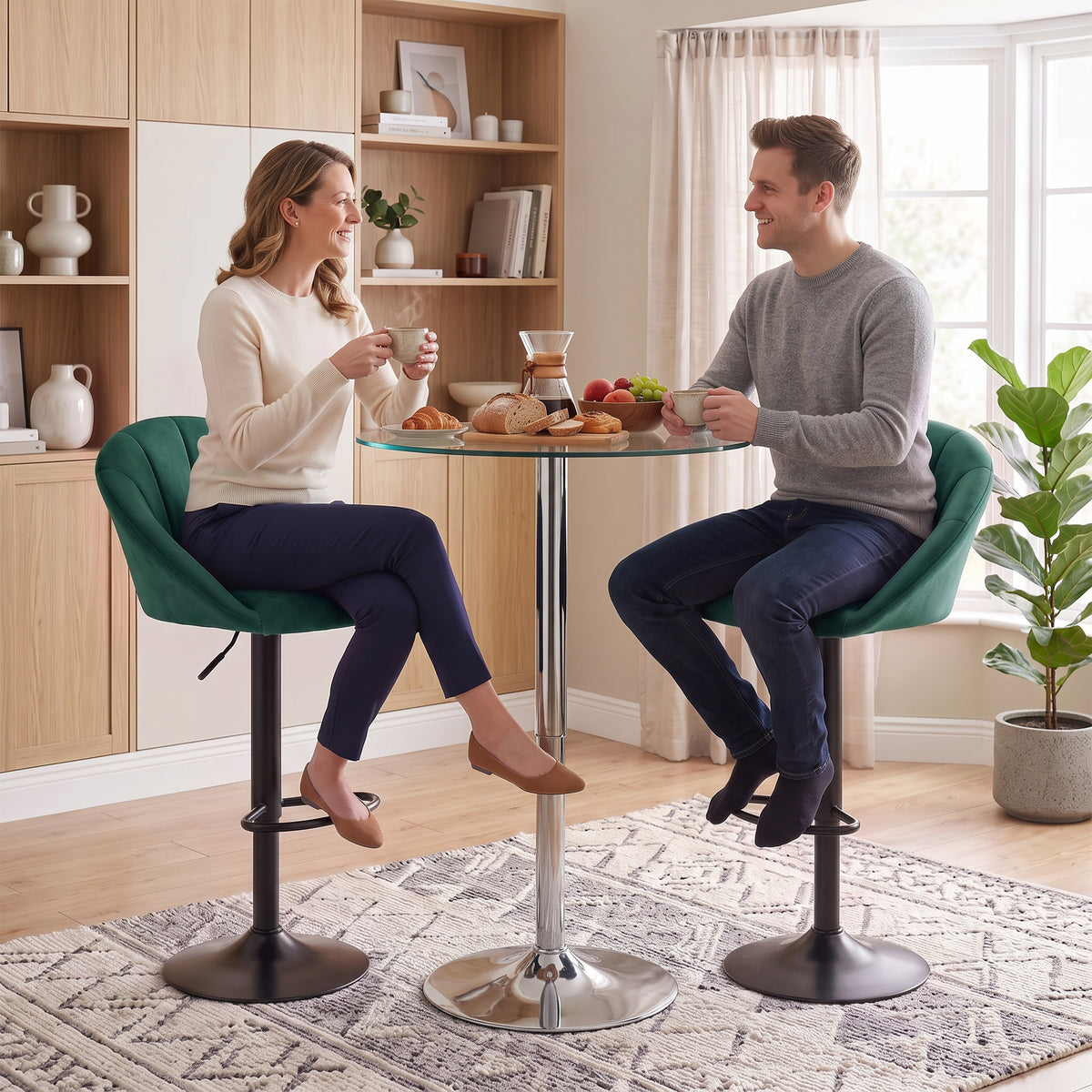 Dark green velvet bar stools with swivel bases and curved backrests