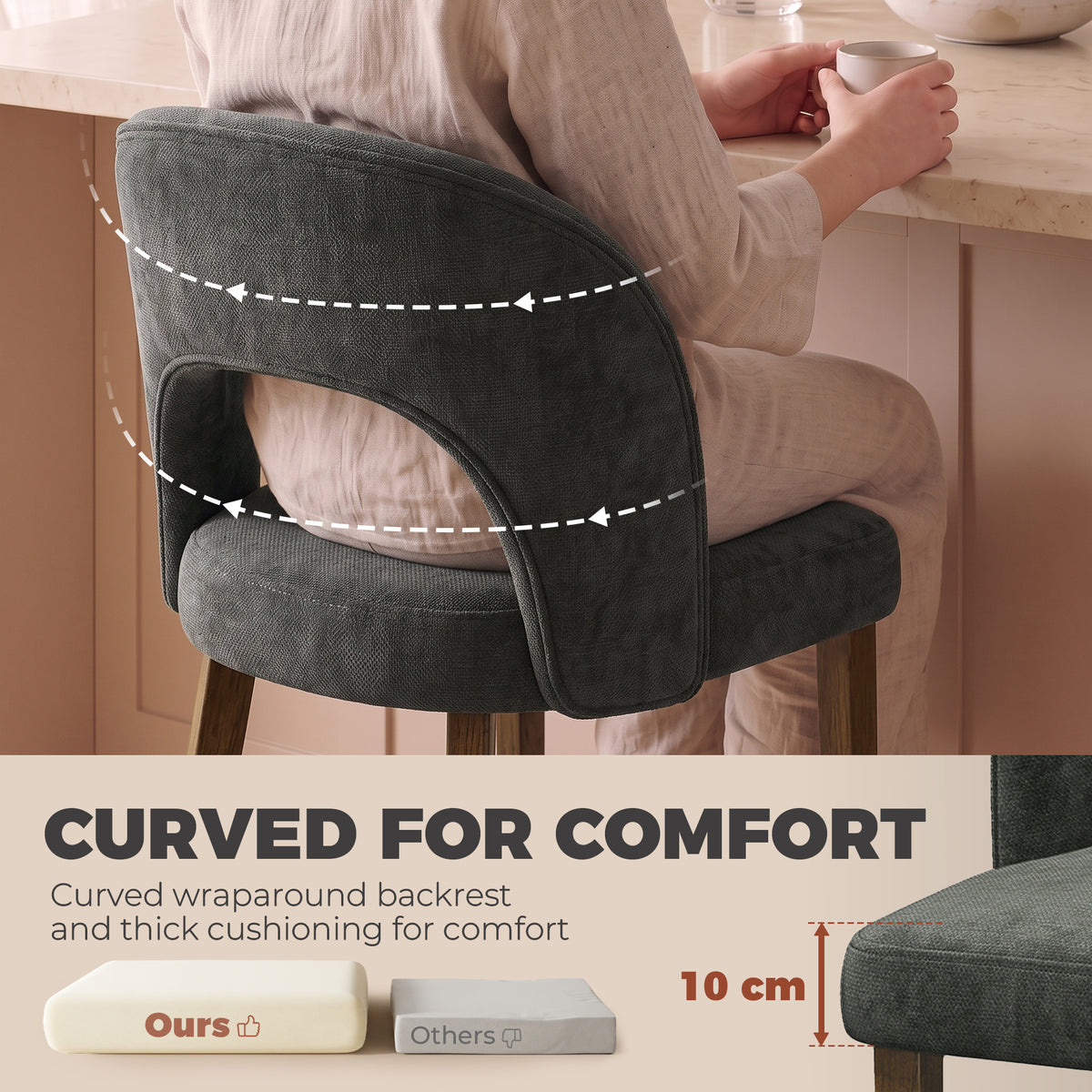 Dark grey upholstered dining chair with curved wraparound back for comfort and wooden legs