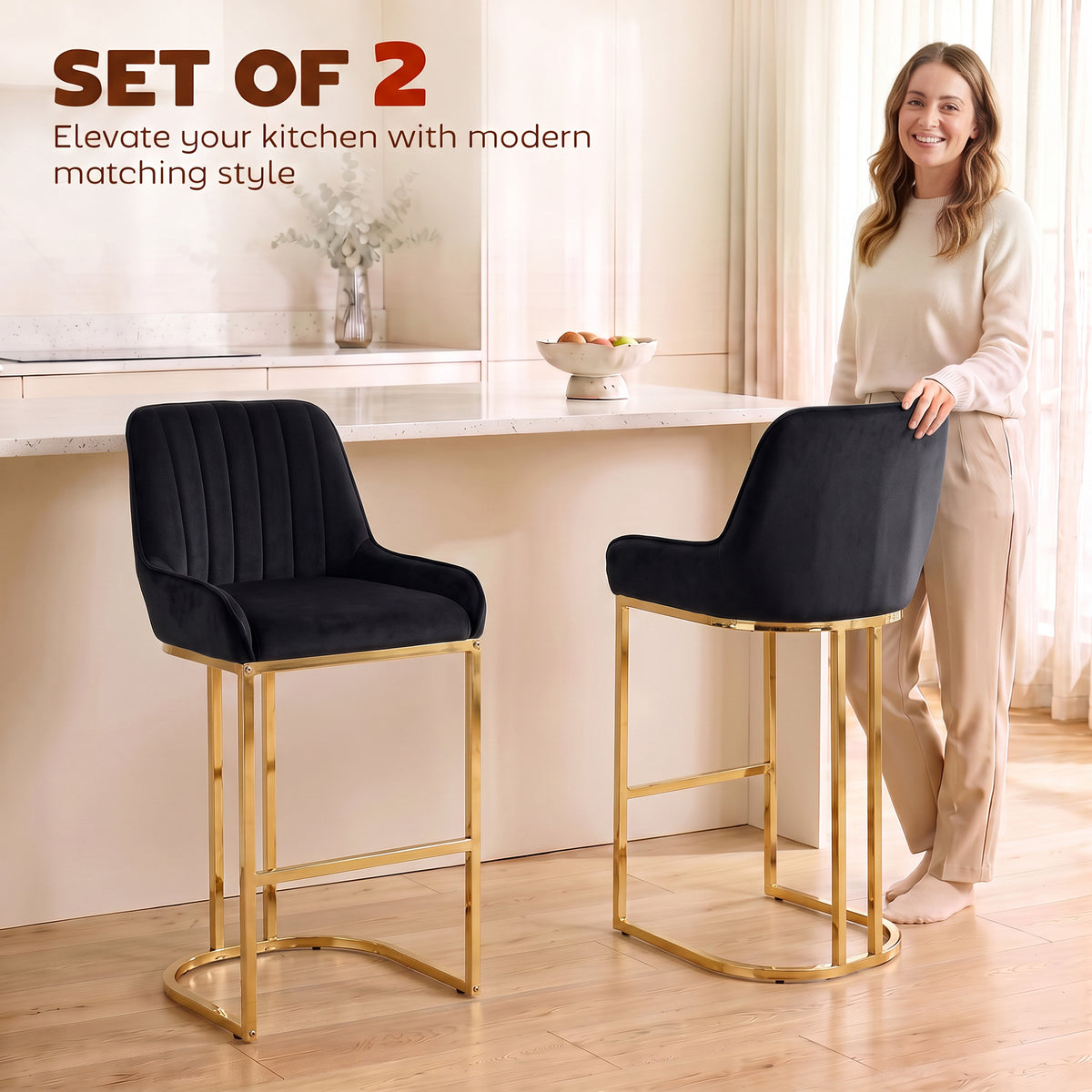 Two black velvet bar stools with gold frames and cushioned seats, modern kitchen style