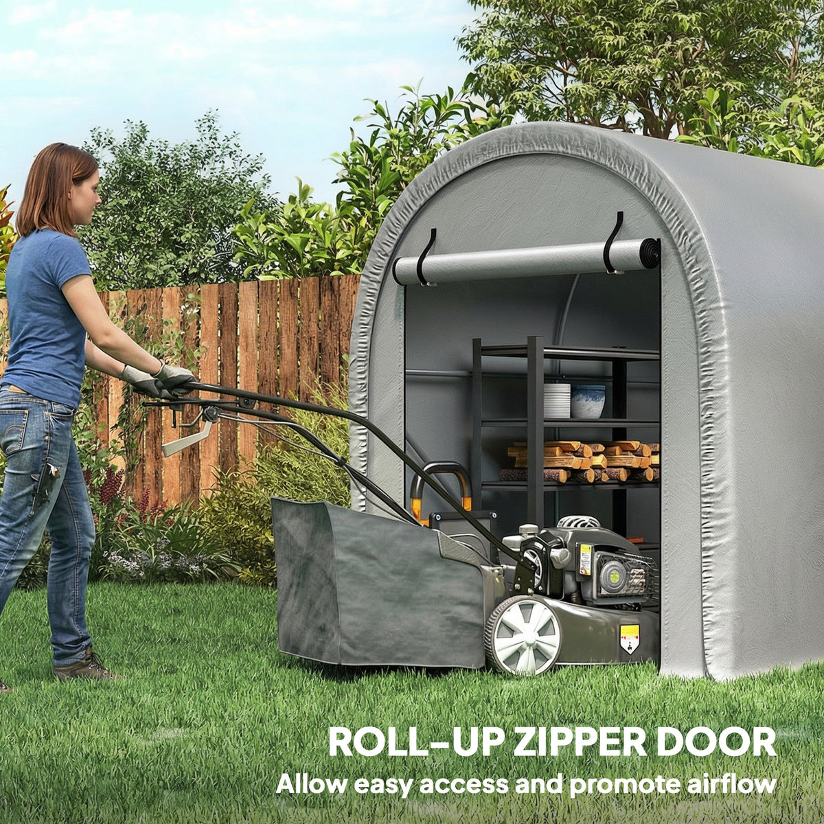 Gray outdoor storage tent with roll-up zip door, person accessing lawn tools inside.