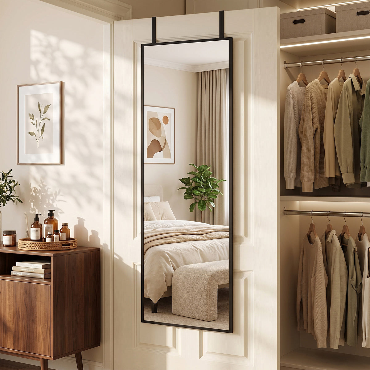Full-length black mirror set in doorway with hook bar for hanging items