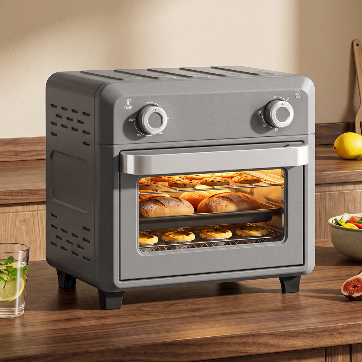 Grey air fryer oven front view with glass window and food inside