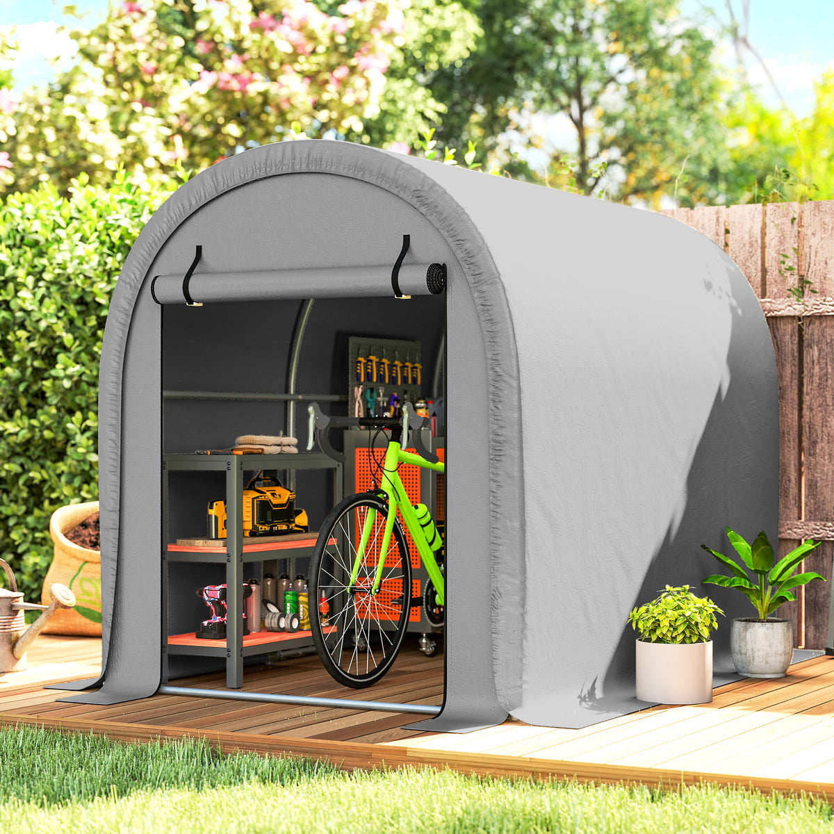 Gray outdoor storage tent with open arched door, tools and bicycle wheel visible inside.