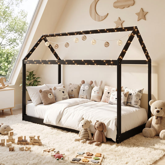 Black house-shaped single bed frame with string lights and platform base