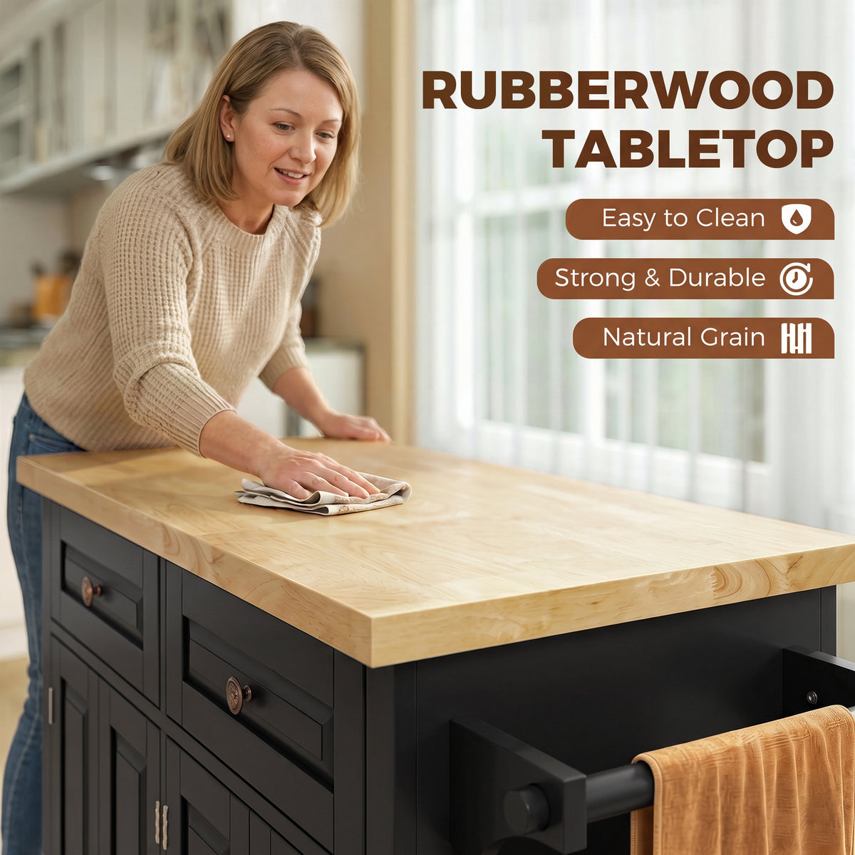 Woman wiping rubberwood tabletop on a black rolling kitchen island cart with drawer storage
