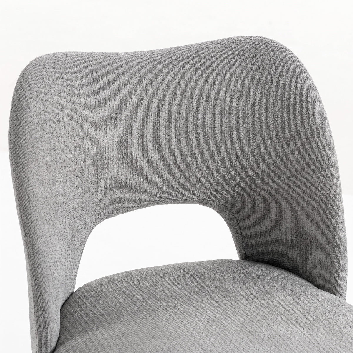 Grey chenille upholstered dining chair with curved high back and armless seat