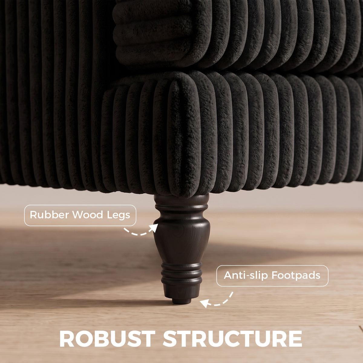 Black corduroy armchair close-up of ribbed upholstery and turned wooden legs