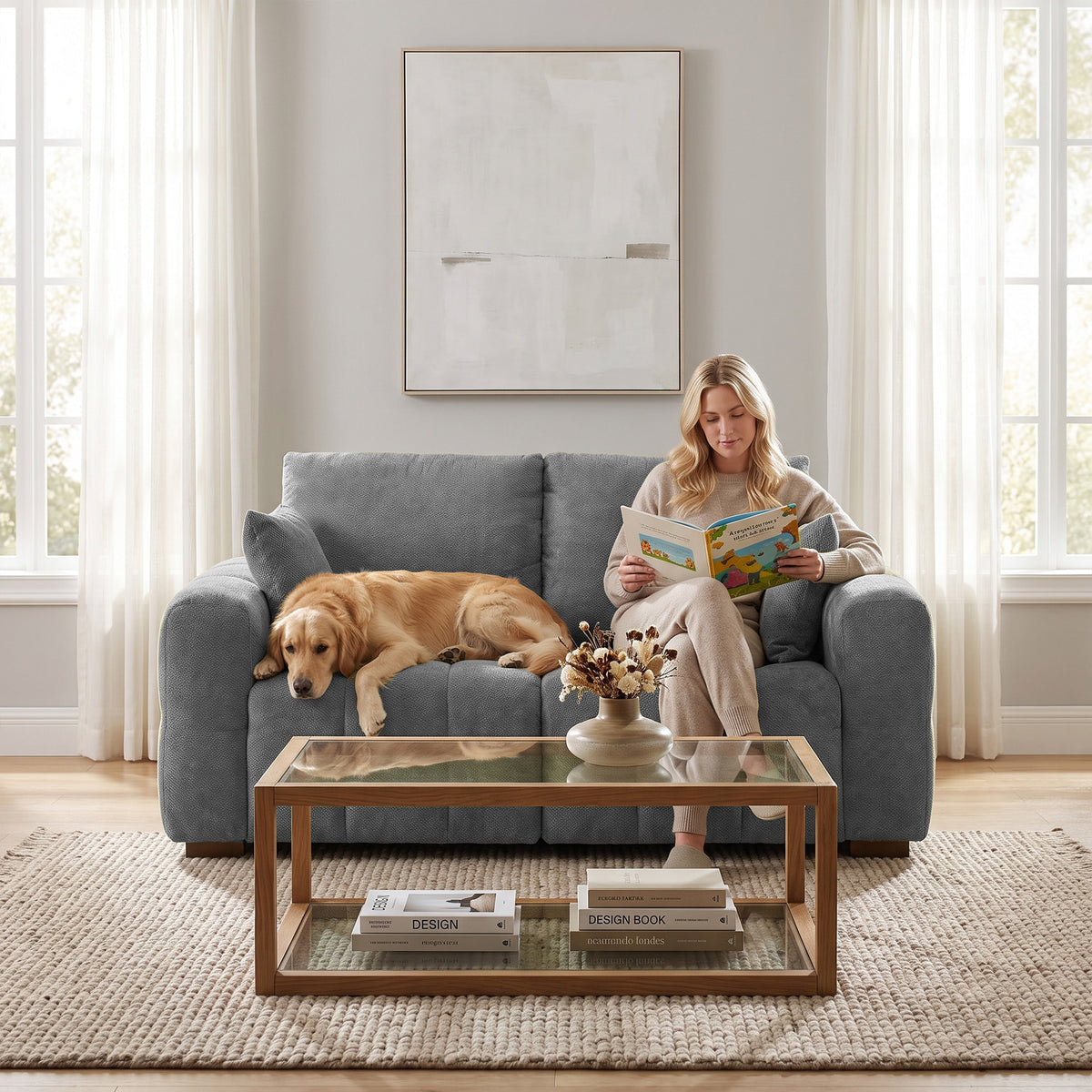 Grey velvet 2-seater sofa with back cushions and wooden legs, center coffee table view.