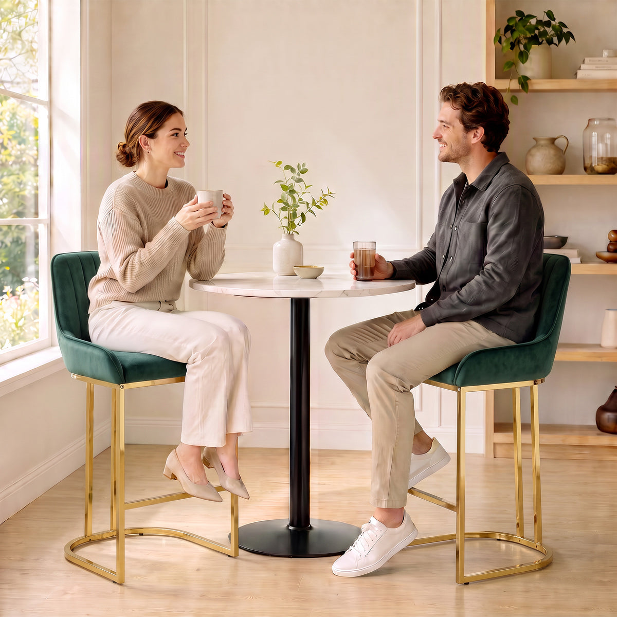 Pair of dark green velvet bar stools with backrests and gold metal legs