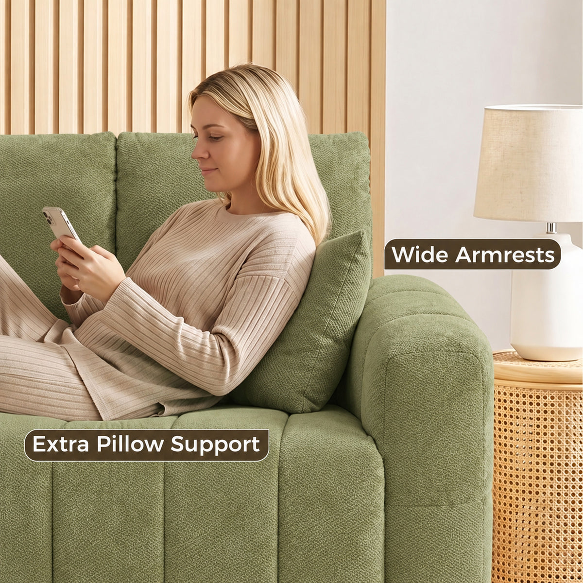 Green velvet sofa armrest and back cushion close-up with supportive pillow design.