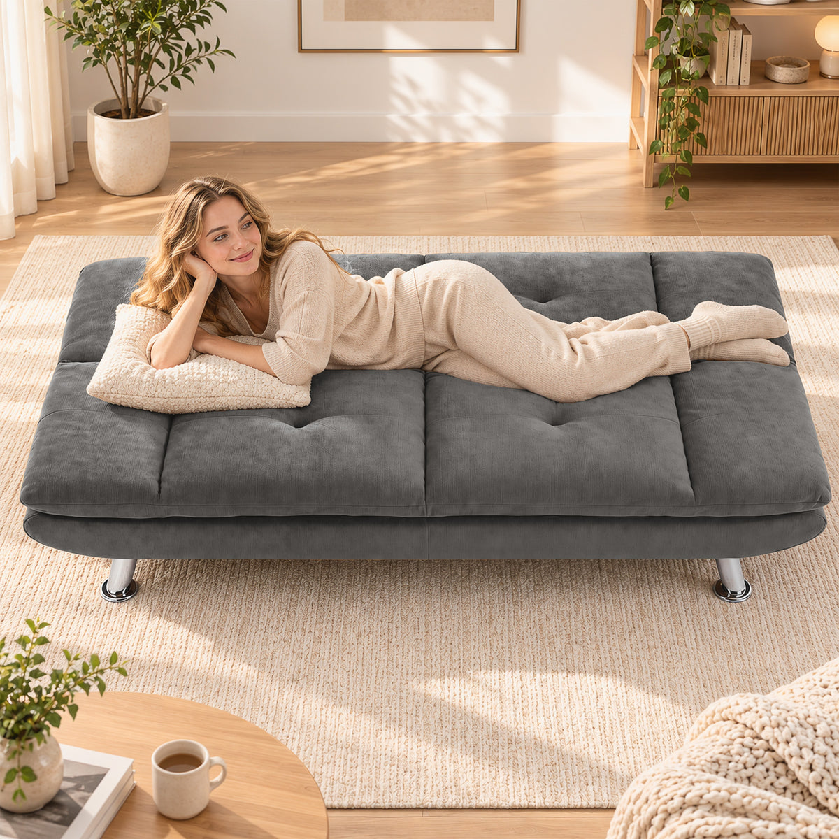Gray sofa bed opened to bed mode with segmented cushioned mattress and legs