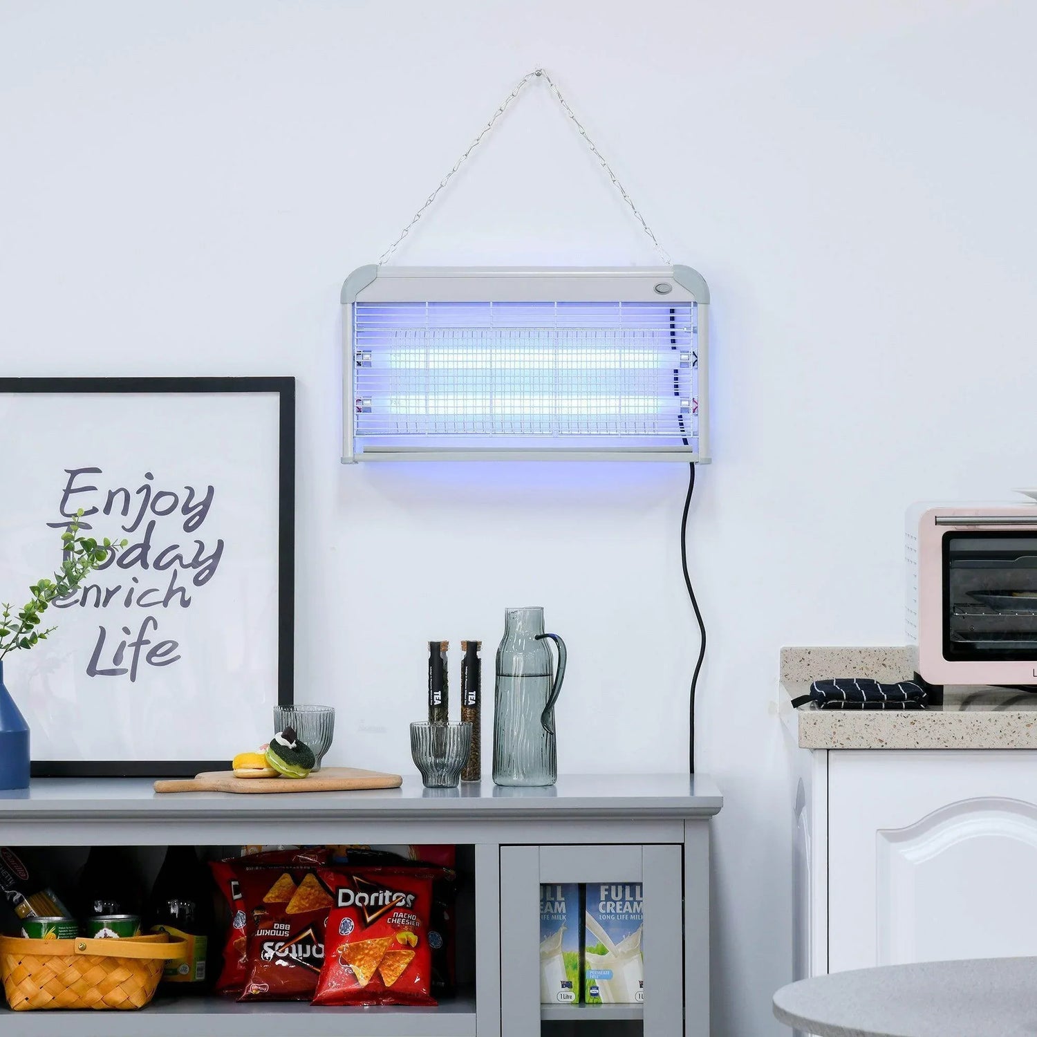 Electric fly zapper lamp with blue UV light tubes behind protective wire grid