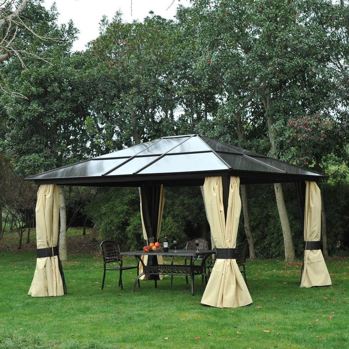 Hardtop gazebo: dark frame, clear polycarbonate roof, beige mosquito net curtains