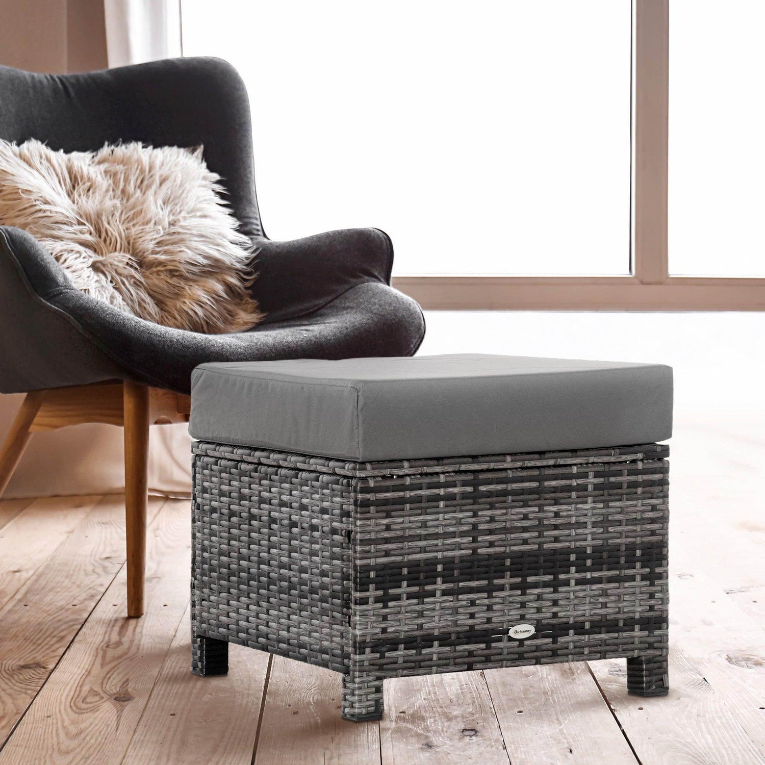 Square outdoor rattan ottoman with gray cushion and dark woven sides
