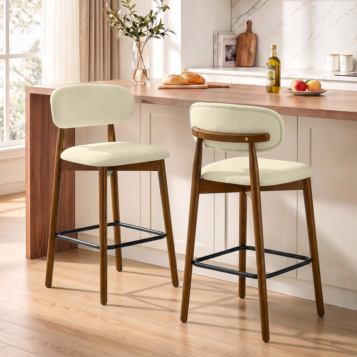 Set of 2 beige bar stools with chenille-like seats, curved backrests, black footrests