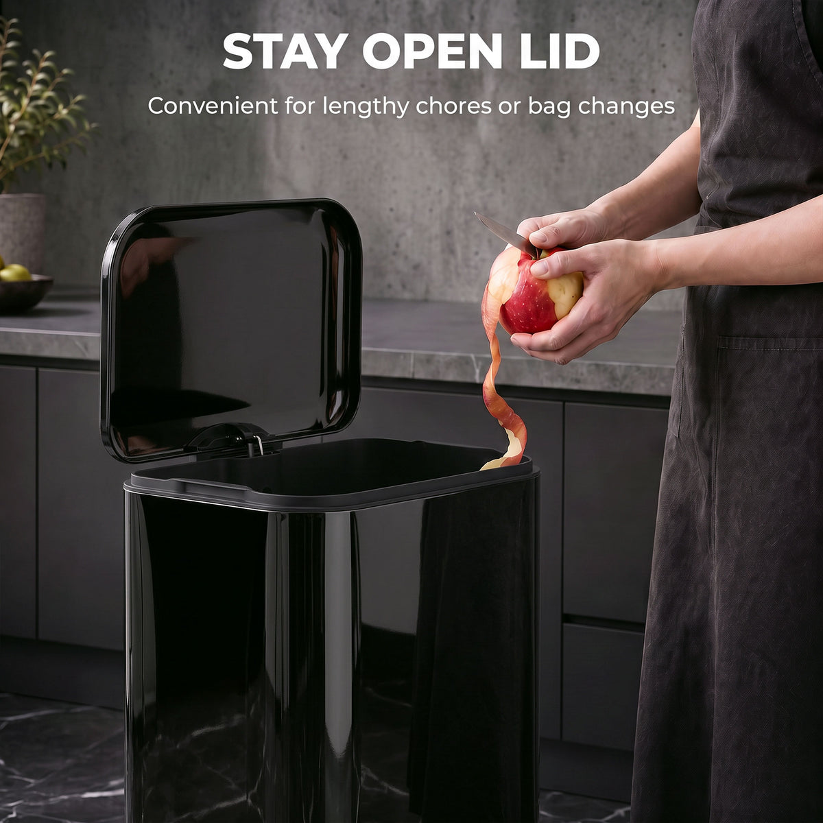 Black kitchen pedal bin with lid propped open