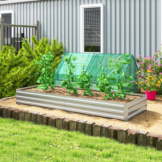 Silver metal raised garden bed planter box with open sides, filled with young plants