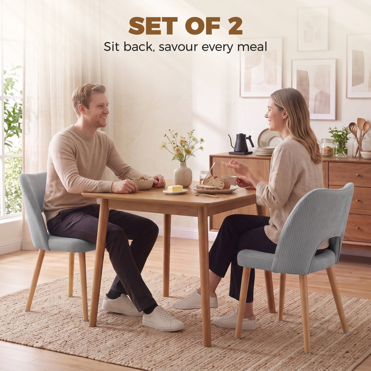 Set of 2 grey chenille dining chairs with curved backs and light wood legs