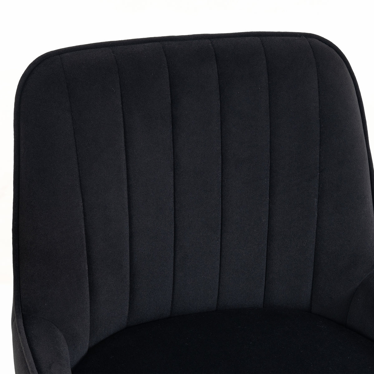 Black velvet bar stool backrest close-up with vertical pleats and curved padded seat base