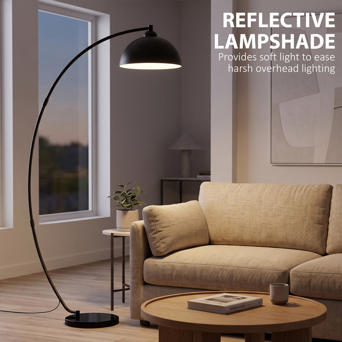 Black arc floor lamp with reflective bowl shade and arched metal frame