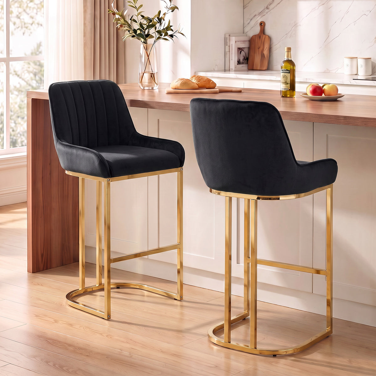 Pair of black velvet bar stools with gold steel legs and backrest, curved footrest