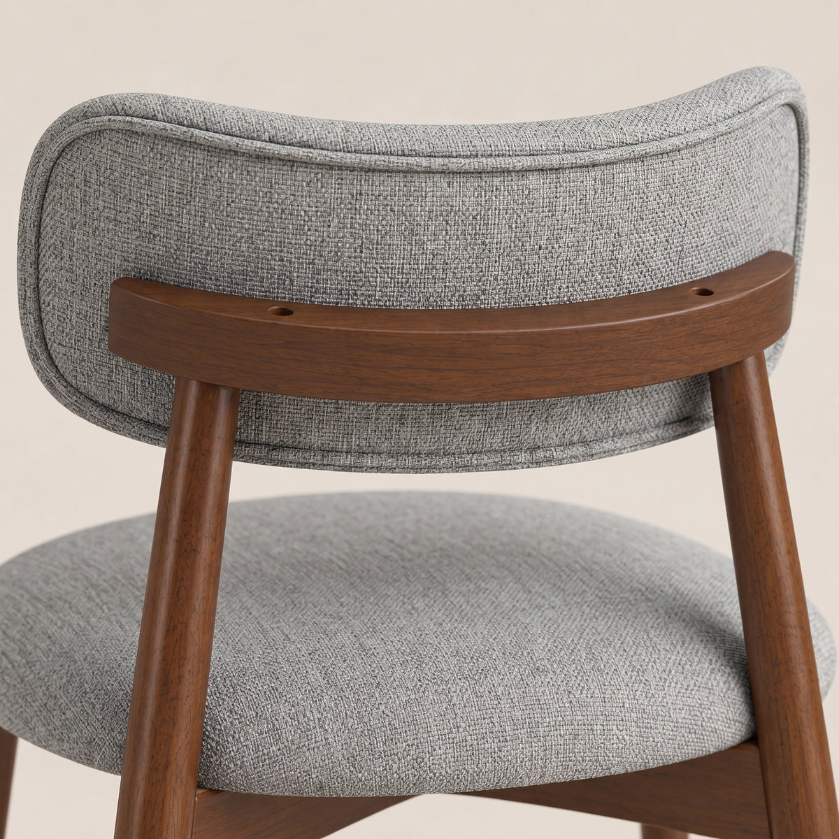 Grey chenille dining chair with curved upholstered back and rubberwood legs