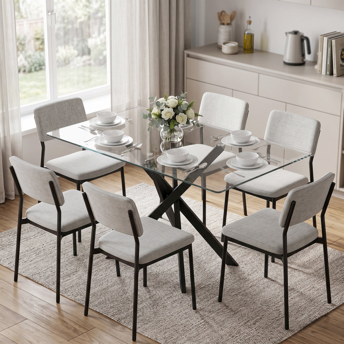 Tempered glass dining table with clear glass top and black X steel legs