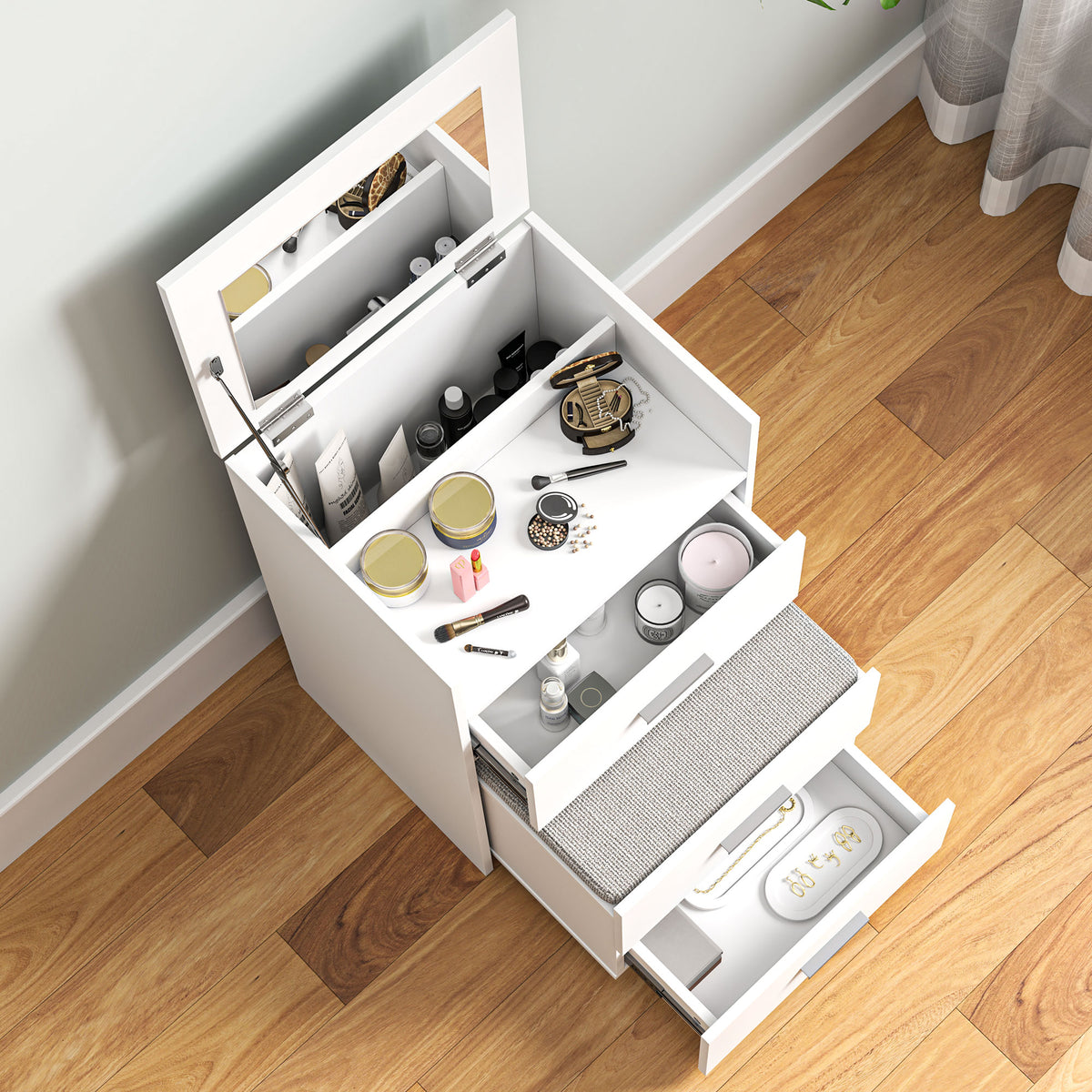White vanity desk with open drawers and compartments for cosmetics.