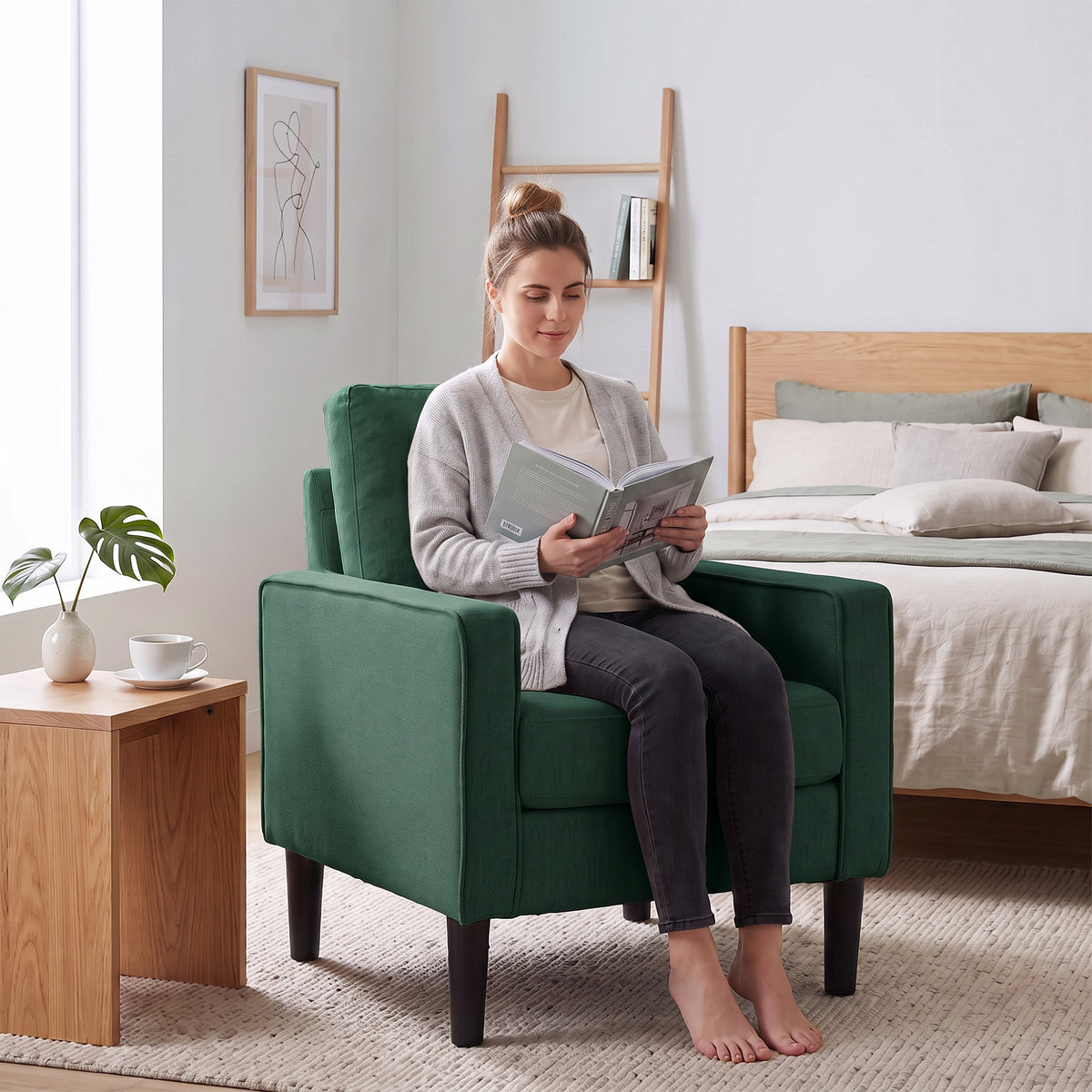 Dark green armchair with plush seat cushion and back pillow