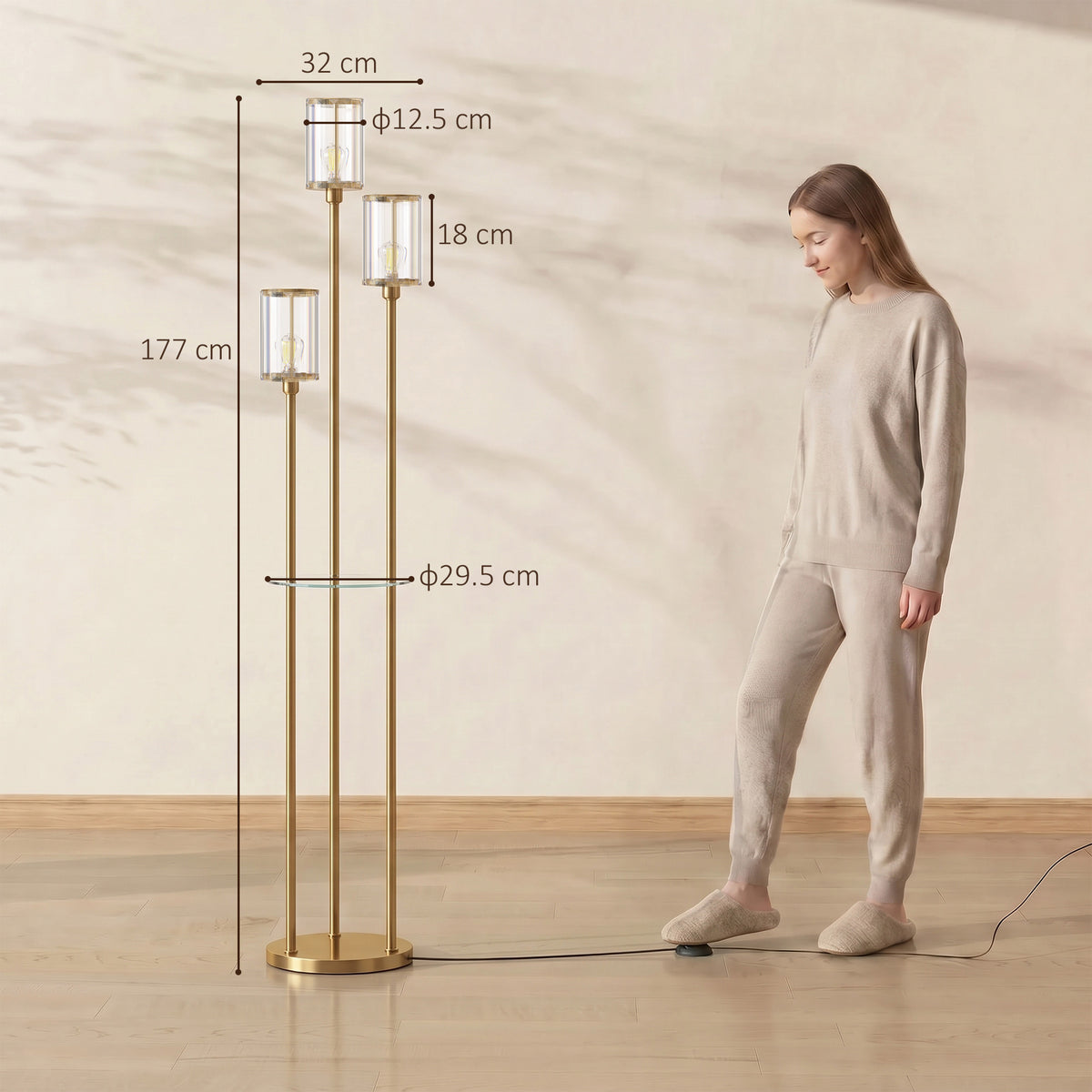 Gold three-light floor lamp with glass shelf and three clear crystal-like glass shades