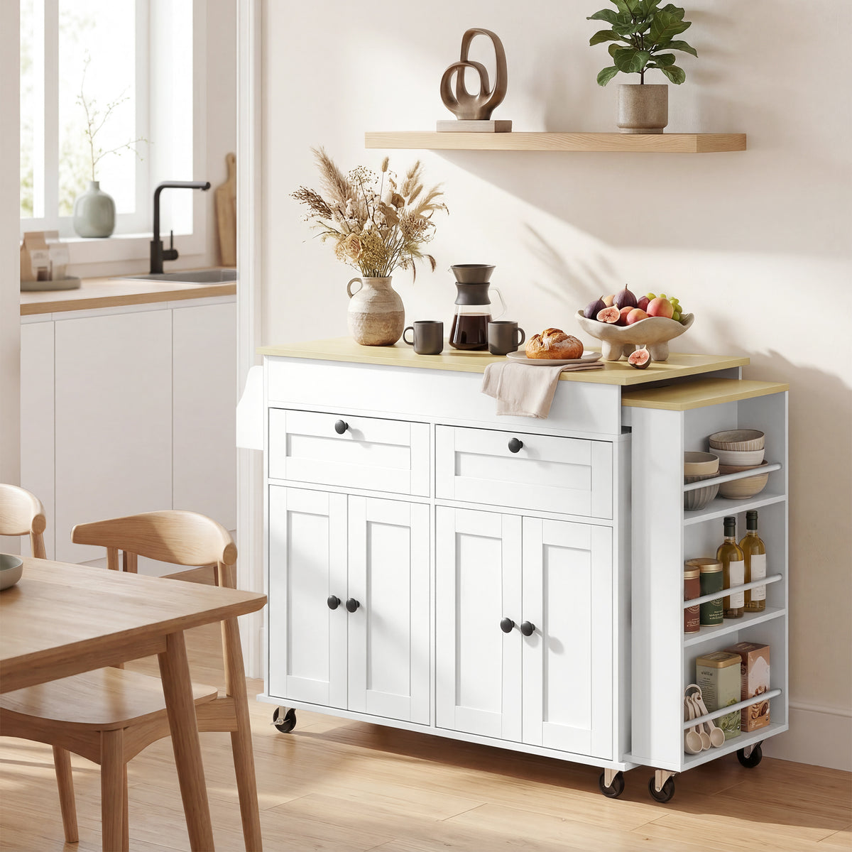 White rolling kitchen island with light wood top, open shelving pantry, and caster wheels.