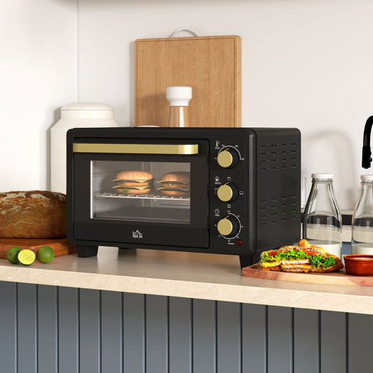 Black countertop toaster oven with viewing window and three front control dials