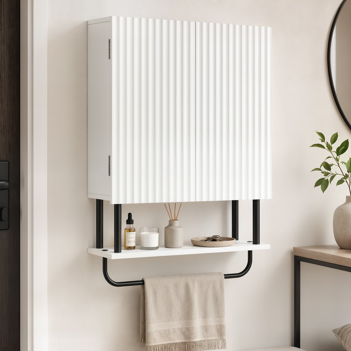 White wall-mounted bathroom cabinet with ribbed door, open shelf, and black towel bar