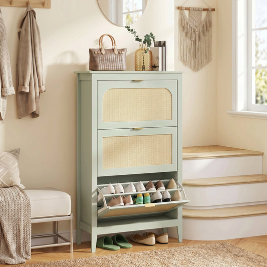 Light green narrow shoe cabinet with three rattan flip drawers and open shoe racks.