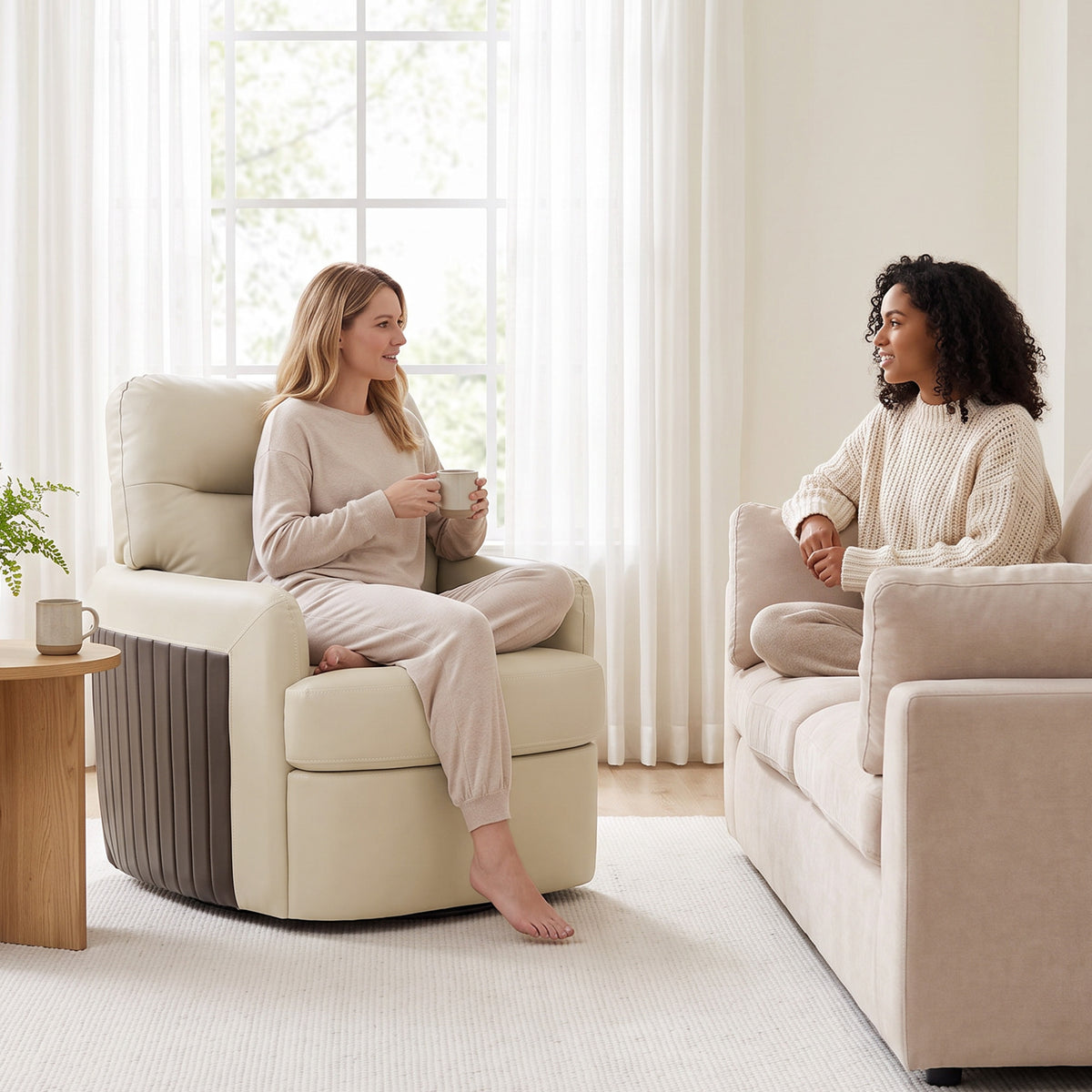 Two cream faux leather swivel accent chairs with dark-brown ribbed side panels