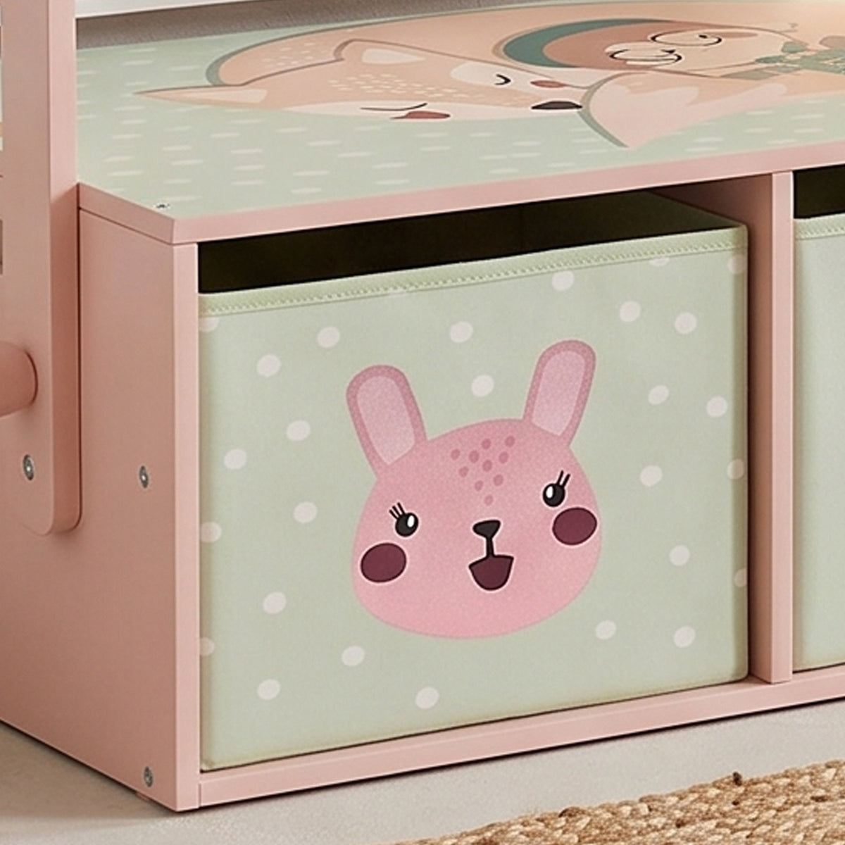 Pink wooden storage bench front panel with rabbit face graphic and open cubby